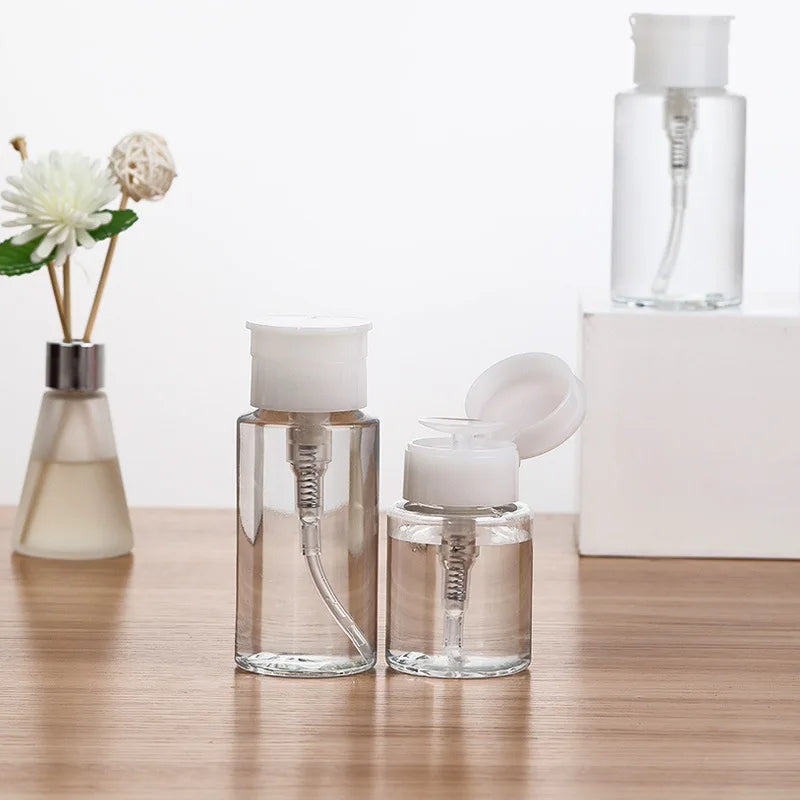 Refillable push-type dispenser bottle for nail polish and makeup remover, clear plastic container with pump nozzle.