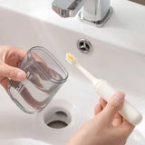 All In 1 SHOPPING 3-in-1 travel toiletry set with toothbrush, toothpaste, and mouthwash cup organizer displayed on a bathroom counter.