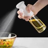 Refillable All In 1 SHOPPING oil spray bottle for cooking, with transparent body and spray nozzle for olive oil and vinegar.
